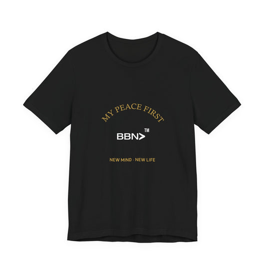 Front product mockup of the black BBN My Peace First Tee with gold My Peace First lettering around a white BBN logo.
