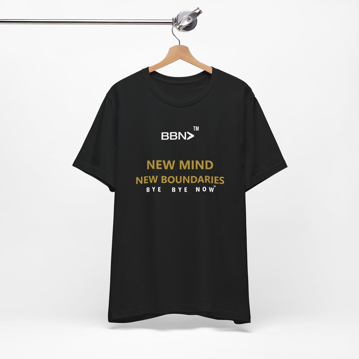 New Mind New Boundaries Tee in black on a wooden hanger, showing the front print.