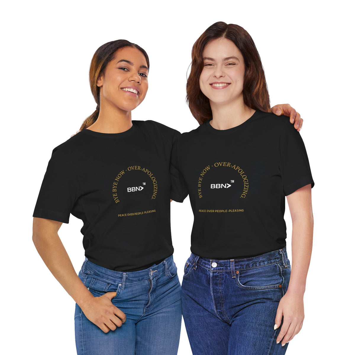 Two women modeling the black BBN Over-Apologizing Tee, showing the front print and fit.