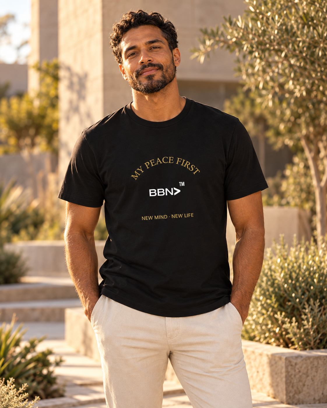 AI styling concept: Man outdoors wearing a black BBN “My Peace First” T-shirt with gold lettering and a white logo.