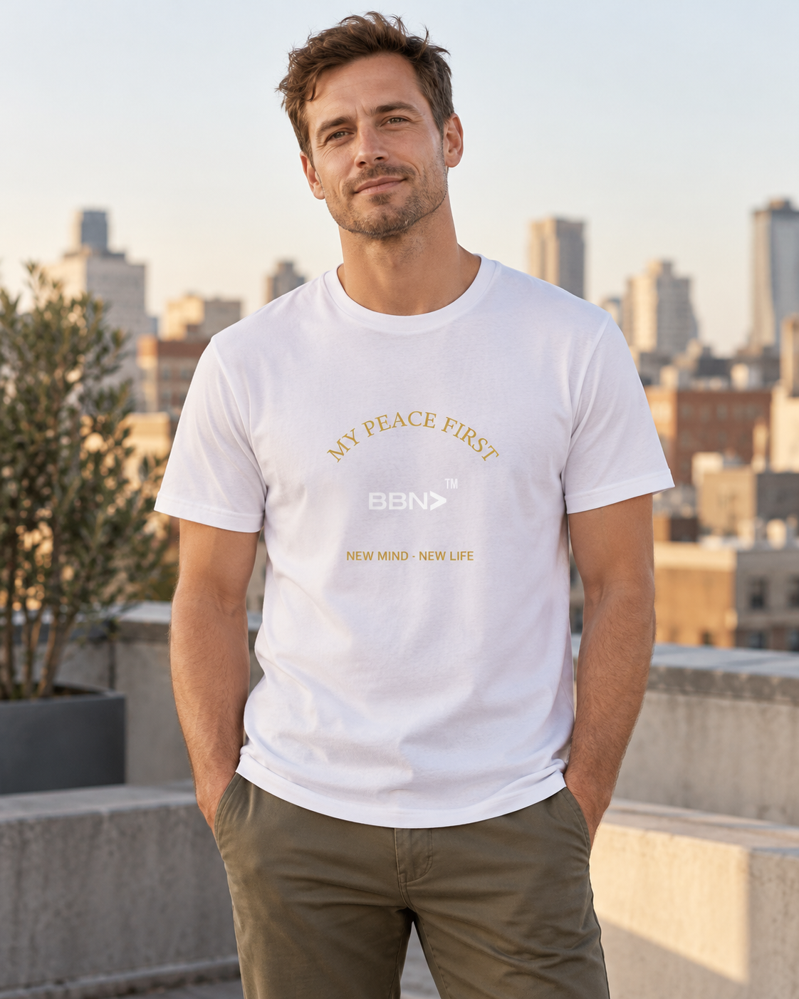 AI styling concept: Man outdoors wearing a white T-shirt with gold “My Peace First” lettering and a white BBN logo.