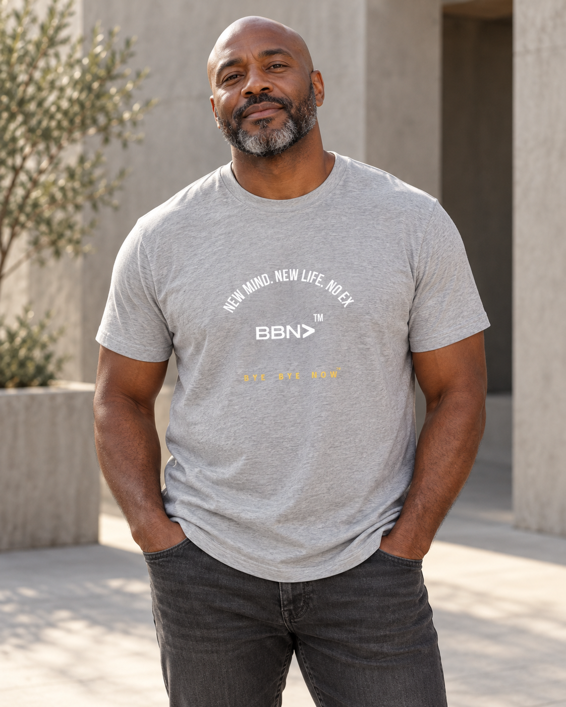AI styling concept: Man outdoors wearing an athletic heather gray T-shirt with white “New Mind New Life No Ex” lettering and a white BBN logo.
