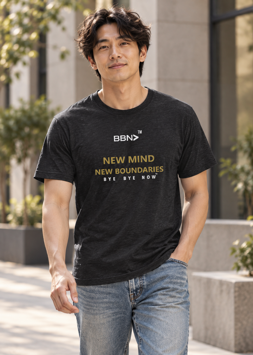 AI styling concept: Man outdoors wearing a black heather T-shirt with gold “New Mind New Boundaries” lettering and a white BBN logo.